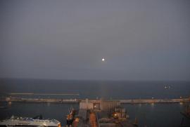 View over Barcelona from Montjuïc: Freight harbor II. The Moon.