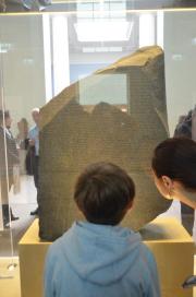 Rosetta stone with fascinated visitors/British Museum