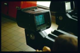 USA 1990/Augusta, GA/Greyhound station waiting room/coin-operated tv set in chair/public
